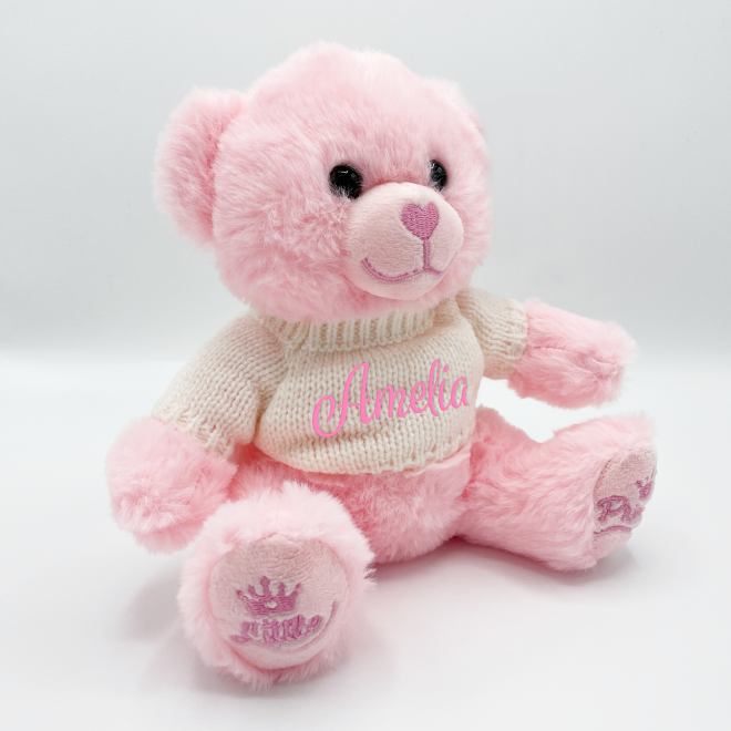 Pink teddy bear with sweater